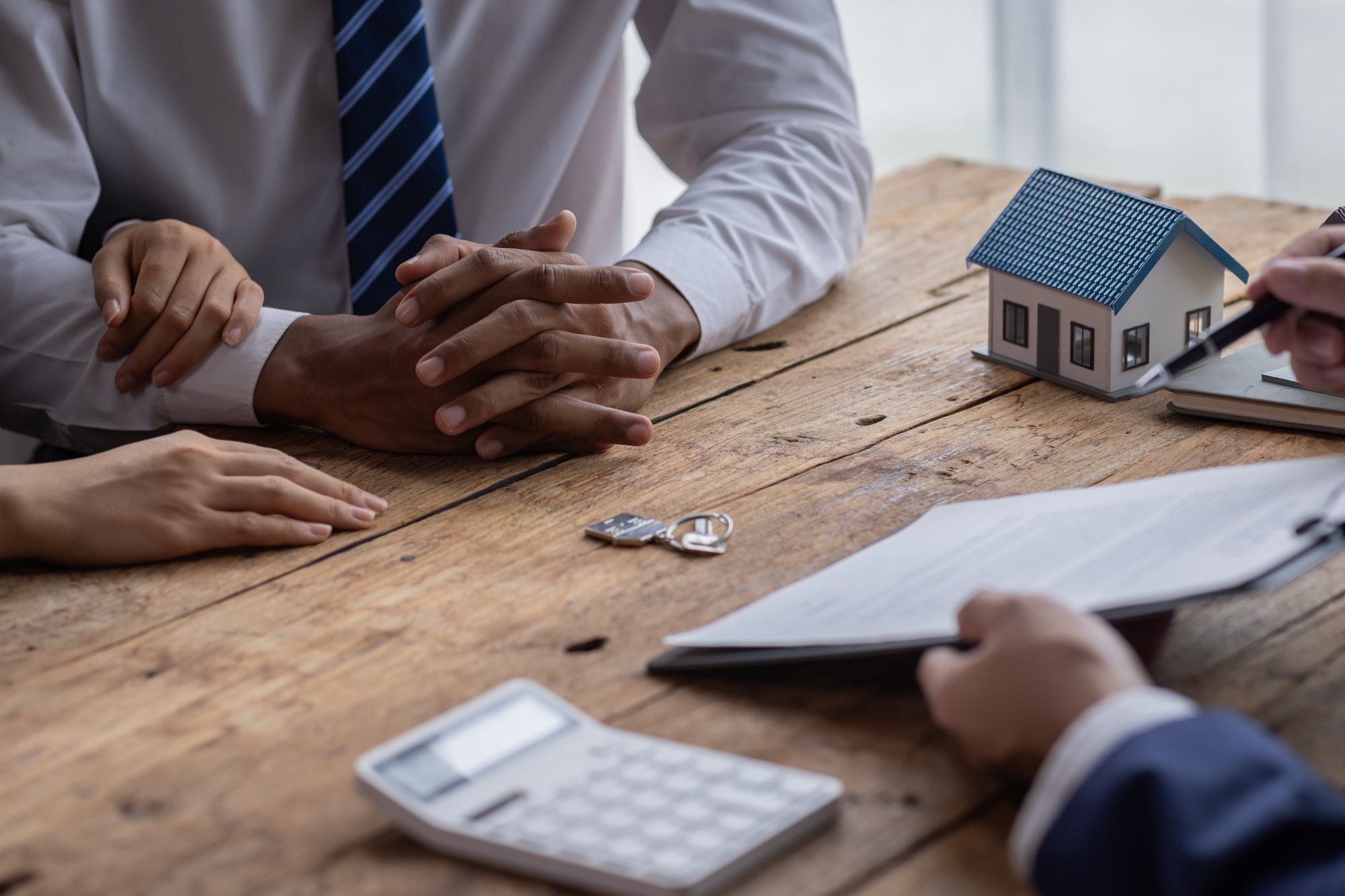 Real estate broker agent presenting and consult to customer to decision making sign insurance form a